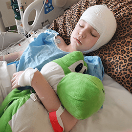 Aiden asleep in hospital bed.