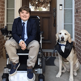 Joel with his service dog.