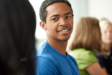 An image of a teen boy smiling.