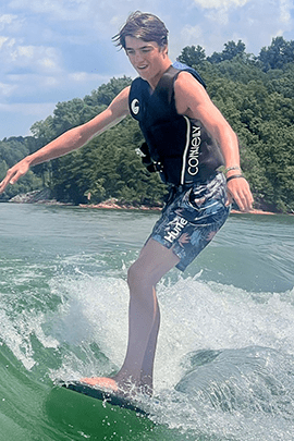 Logan on wakeboard.