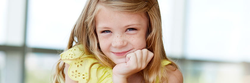 Girl smiles.
