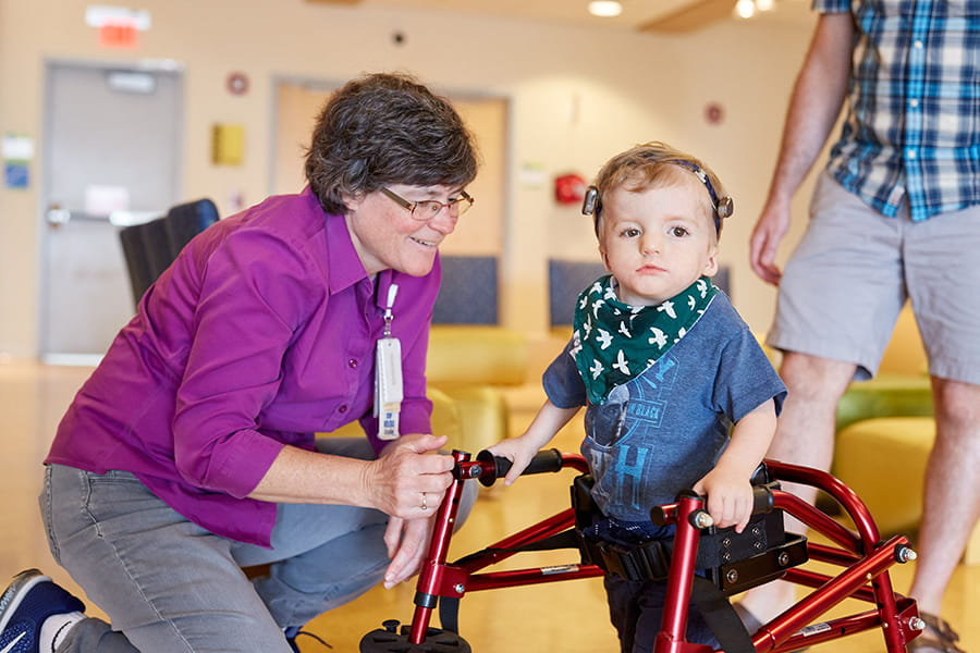 Nurse working with a young child.