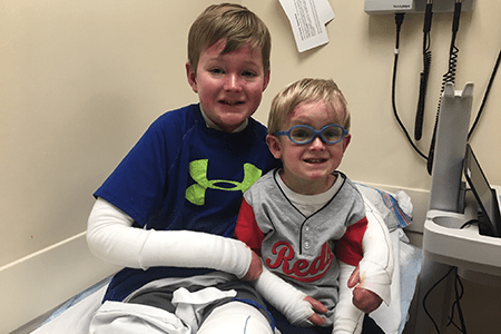 Carson and Kolbe smile.