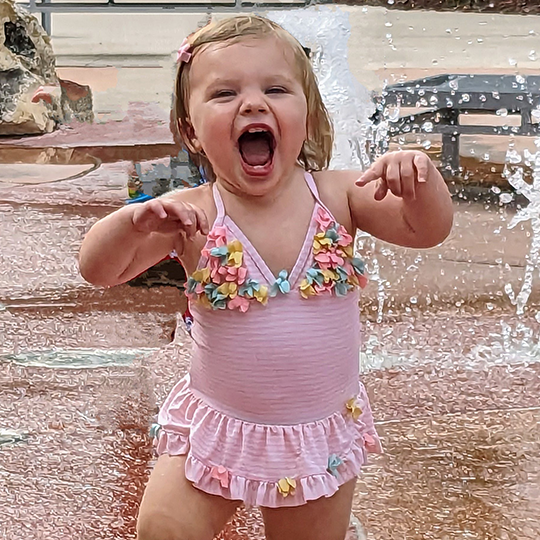 Chloe plays in water.