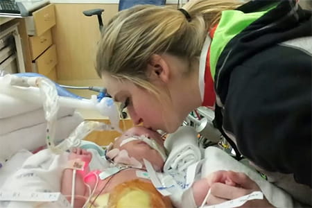 Henley in the hospital with her mom.