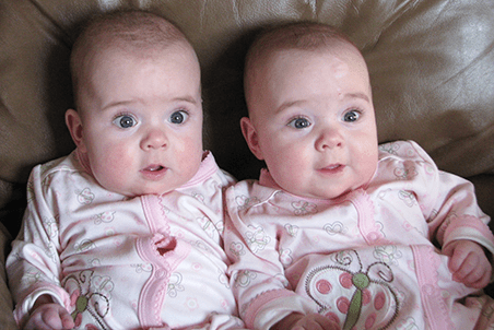 Twins smile.