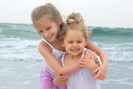 Lila and sister smile.