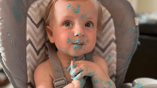 Trey with icing on his face.