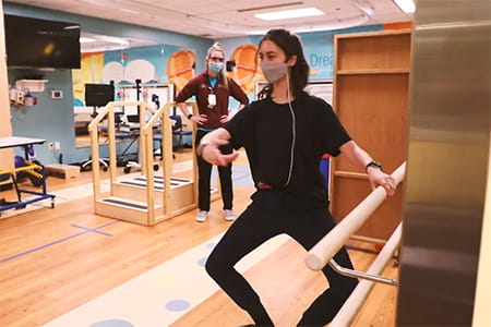 Farah doing physical and occupational therapy.