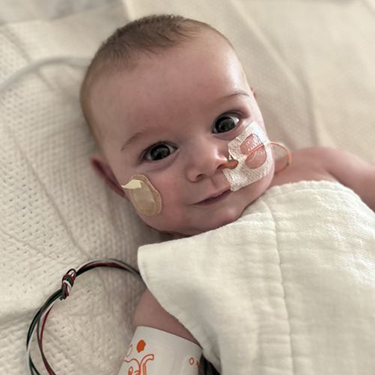 Heart surgery patient, David, smiles at the camera.