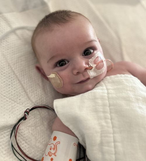 Heart surgery patient, David, smiles at the camera.