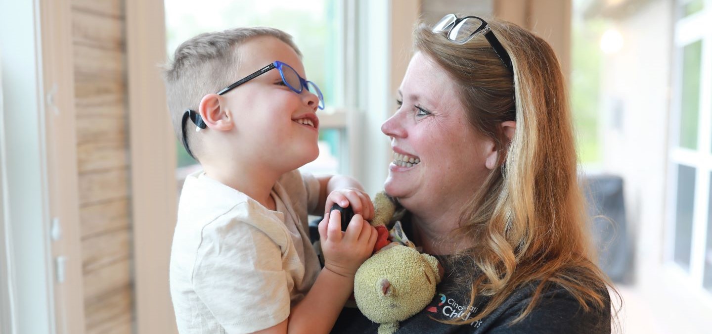 Barrett long, a patient of the hemophilia and bleeding disorders, with employee Julie Doyle.