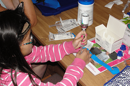 Olivia works on her own treatment.