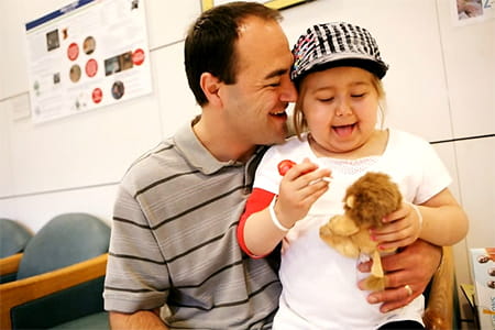 Ashtyn smiling with her dad.