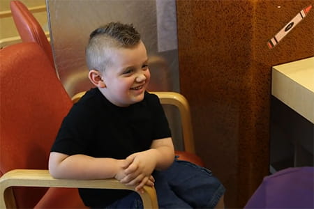 HLH patient, Brantley, smiling.