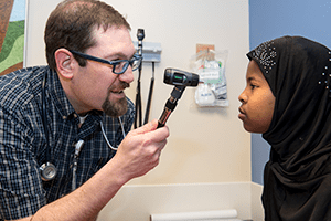 A infectious diseases doctor and his patient.