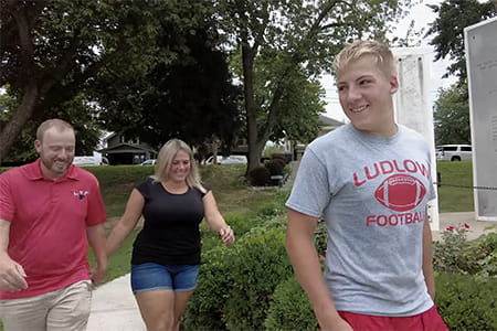 Matthew and his parents.