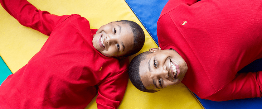 An image of brothers smiling.