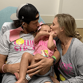 Collins with her parents.