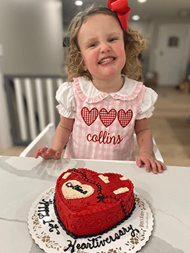 Collins smiles with her cake.