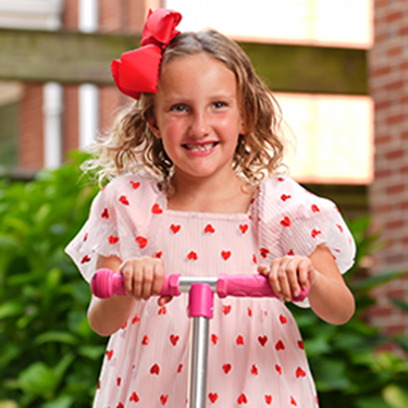 Collins smiles on her scooter.