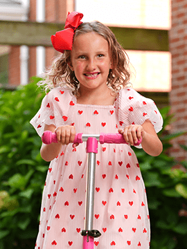 Collins smiles on her scooter.