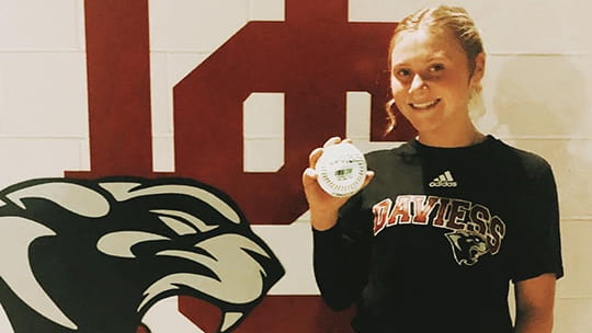 Macy with home run ball.