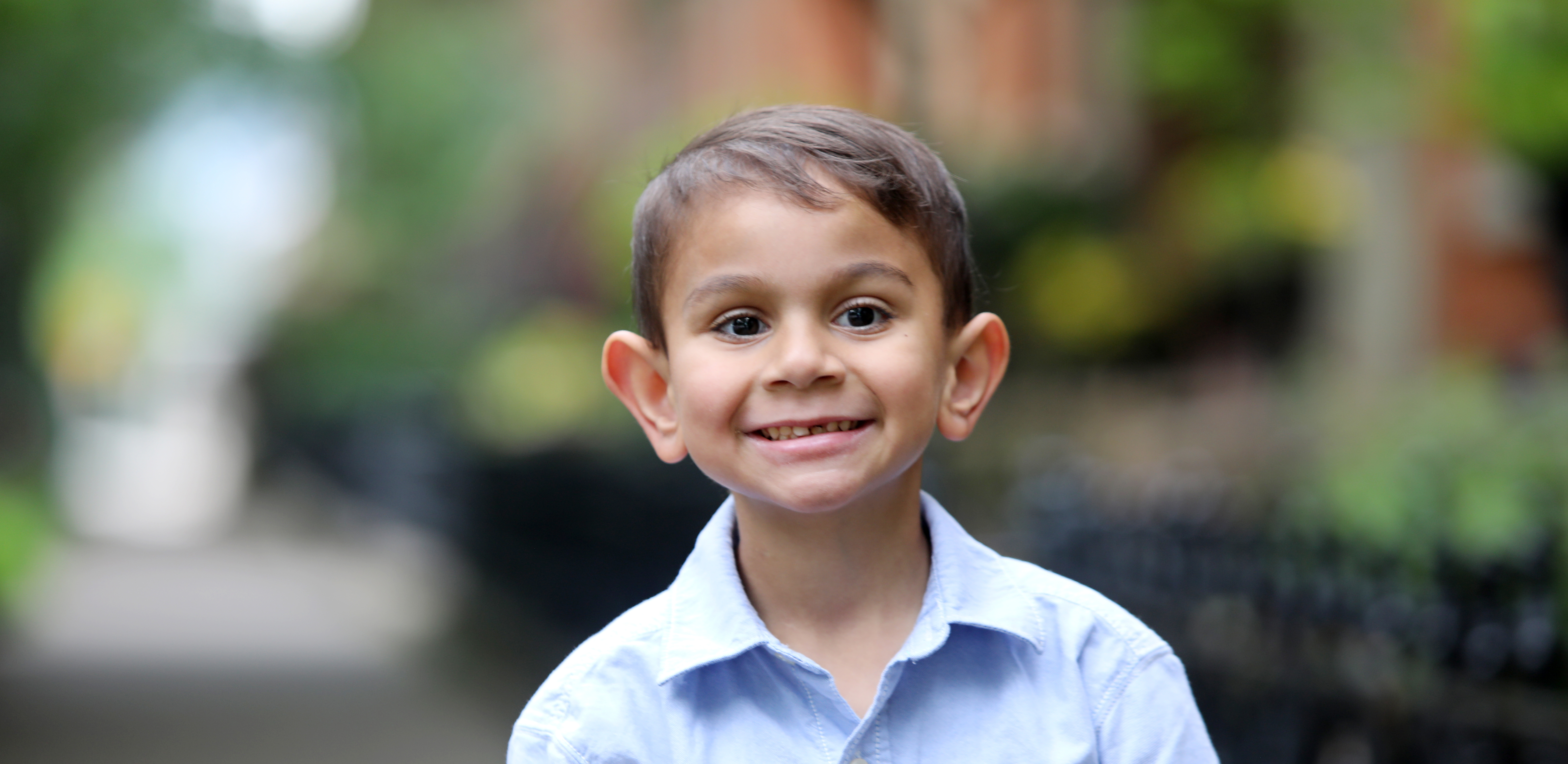 A photo of a child smiling.