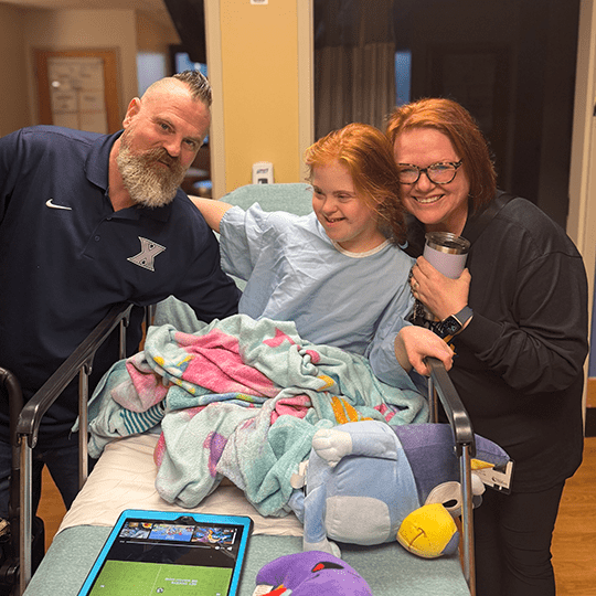 Caroline with her parents.