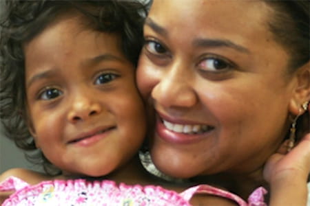 Isabella and her mother smiling.