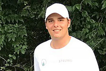 Brady Walz working at his lawn care business.