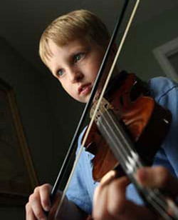 Timothy playing the fiddle.