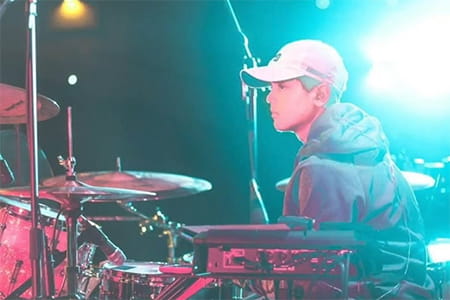 Ben Weeks playing the drums.