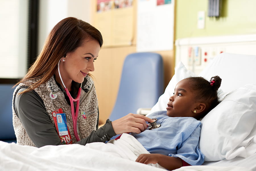 A nurse examining a patient.