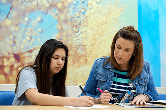 Clinician working with a patient during a visit.