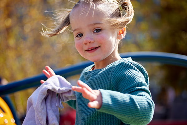 A photo of a girl smiling.