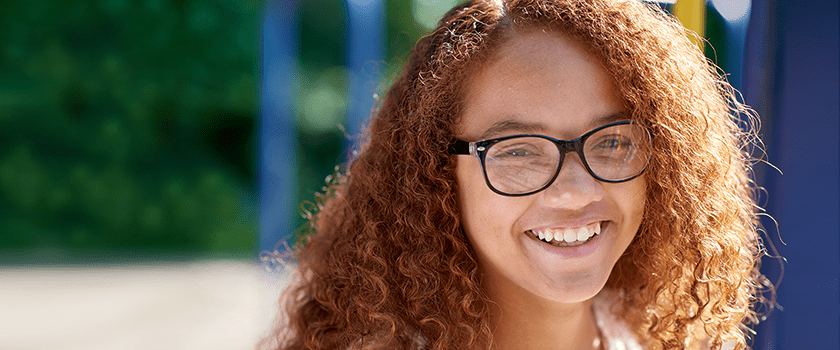 An image of a teen girl smiling.