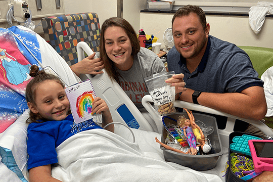 Addison with her parents.