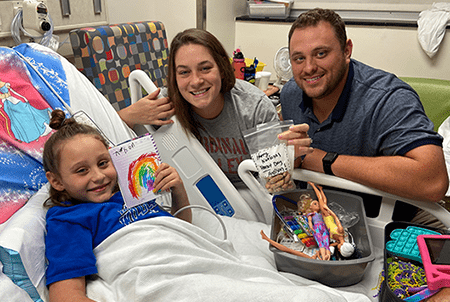 Addison with her parents.