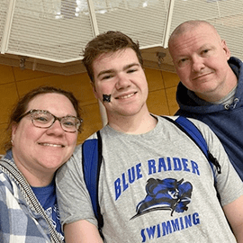 Ethan and his parents.