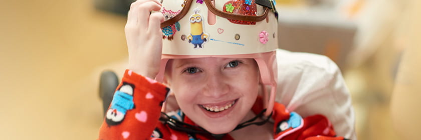 Neurosurgery patient smiling during a clinic visit.