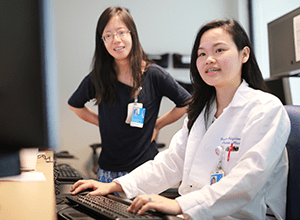 A photo of neurology doctors in the EEG reading room.