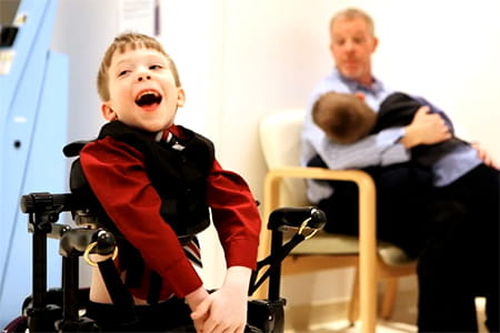 Dillon, OT-PT patient, smiling.