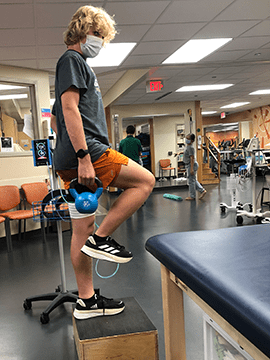 Owen takes part in physical therapy.