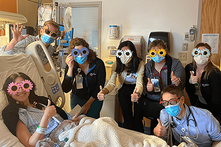 Bella and some of her care team.