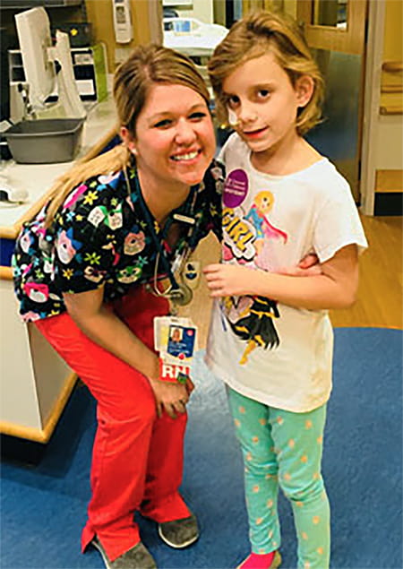 Roxy with Cincinnati Children's nurse.