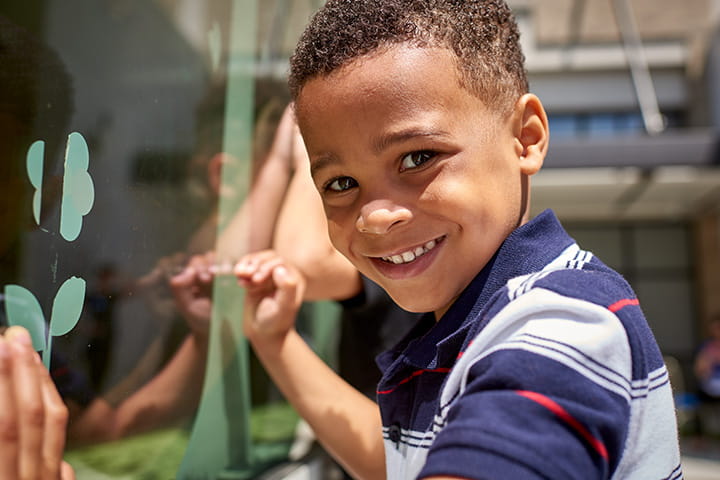 A photo of a child smiling.