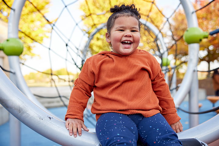 A photo of a child smiling.