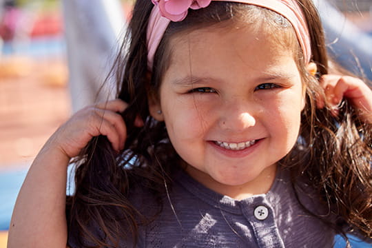 An image of a child smiling.