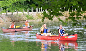 Kids canoeing at Camp Joy.